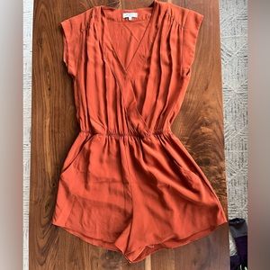 Babaton (Aritzia) 100% silk rust colored romper. Like new.